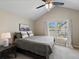 Inviting bedroom with vaulted ceilings, natural light, and neutral color palette at 9676 W Chatfield Ave # B, Littleton, CO 80128