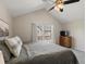 Bright bedroom with vaulted ceilings, plenty of natural light, and room for dresser or desk at 9676 W Chatfield Ave # B, Littleton, CO 80128