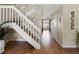 Foyer featuring hardwood floors and a staircase at 9676 W Chatfield Ave # B, Littleton, CO 80128