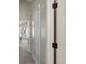 Hallway featuring carpet floors with many doorways leading to bedrooms and closet space at 9676 W Chatfield Ave # B, Littleton, CO 80128