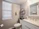 Cozy bathroom with neutral tones, modern fixtures, and great natural light at 10961 Main Range Trl, Littleton, CO 80127