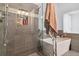 Spa-like bathroom boasting a luxurious bathtub and a stylish glass-enclosed shower at 10961 Main Range Trl, Littleton, CO 80127