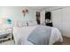 Bedroom with light green walls, closet, and white furniture offering a serene atmosphere at 10961 Main Range Trl, Littleton, CO 80127