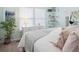 Inviting bedroom featuring a calming color scheme and plenty of natural light from the windows at 10961 Main Range Trl, Littleton, CO 80127