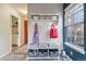 Inviting entryway with a stylish bench, storage, and natural light at 10961 Main Range Trl, Littleton, CO 80127