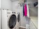 Functional laundry room with modern appliances and ample storage space at 10961 Main Range Trl, Littleton, CO 80127