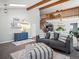 Bright living room with hardwood floors, modern furnishings, and an open floor plan at 10961 Main Range Trl, Littleton, CO 80127