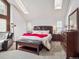 Bright and airy bedroom with vaulted ceilings and neutral decor evokes a sense of tranquility at 10961 Main Range Trl, Littleton, CO 80127