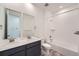 Bathroom featuring dual sinks, a soaking tub and modern fixtures at 3147 S Russell St, Morrison, CO 80465