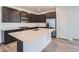 Modern kitchen with stainless steel appliances, a quartz countertop island, and ample cabinet space at 3147 S Russell St, Morrison, CO 80465