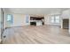 Spacious living and kitchen area with hardwood floors, modern lighting, and large windows at 3147 S Russell St, Morrison, CO 80465
