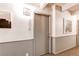 Apartment 408 entry featuring two-tone paint, building art, and carpeted hallway at 1265 Race St # 408, Denver, CO 80206