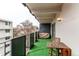 Cozy balcony with artificial turf and seating provides a relaxing outdoor living space at 1265 Race St # 408, Denver, CO 80206