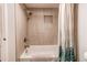 Updated bathroom with tiled shower/tub combination and modern fixtures at 1265 Race St # 408, Denver, CO 80206