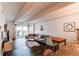 Bright living room with a large sofa, wood floors, and a glass sliding door at 1265 Race St # 408, Denver, CO 80206