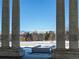 Framed view from Cheesman Park pavilion, showcasing snow-covered grounds and a striking mountain backdrop at 1265 Race St # 408, Denver, CO 80206