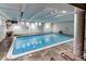 Indoor community pool featuring tile flooring and recessed lighting for year-round enjoyment at 1265 Race St # 408, Denver, CO 80206