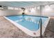 Indoor community swimming pool with clear water and bright lighting, a refreshing amenity for residents at 1265 Race St # 408, Denver, CO 80206