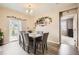 Elegant dining room with modern furnishings, decorative accents, and seamless access to the outdoor patio at 6711 Fraser Cir, Frederick, CO 80530