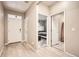 Bright entryway featuring wood floors and views of a bedroom and bathroom at 6711 Fraser Cir, Frederick, CO 80530