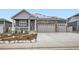Charming home featuring stone accents, solar panels and a spacious three car garage at 6711 Fraser Cir, Frederick, CO 80530