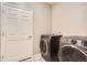 Functional laundry room with modern front-loading washer and dryer set, providing convenience and efficiency at 6711 Fraser Cir, Frederick, CO 80530
