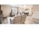 Open living room area with hardwood floors and comfortable leather furnishings at 6711 Fraser Cir, Frederick, CO 80530