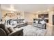 Spacious living room area showcasing hardwood floors and an open floor plan at 6711 Fraser Cir, Frederick, CO 80530