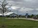 Community playground featuring picnic shelter, tables, benches, and a slide with climbing apparatus at 6711 Fraser Cir, Frederick, CO 80530
