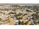 Expansive aerial view of a heavily treed, rural landscape with scattered houses and partial snow cover at 482 Panorama Dr, Elizabeth, CO 80107