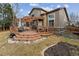 Large backyard featuring a multi-level deck with pergola, ideal for outdoor enjoyment at 10358 Kelliwood Way, Highlands Ranch, CO 80126