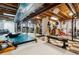 Spacious basement with gym equipment at 10358 Kelliwood Way, Highlands Ranch, CO 80126