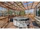 Outdoor deck featuring hot tub beneath a wooden pergola, perfect for relaxation at 10358 Kelliwood Way, Highlands Ranch, CO 80126