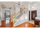 Inviting foyer with staircase and hardwood floors at 10358 Kelliwood Way, Highlands Ranch, CO 80126