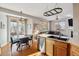 Bright kitchen flows into dining area with hardwood floors and access to the deck at 10358 Kelliwood Way, Highlands Ranch, CO 80126