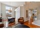 Living room and dining room combo with vaulted ceilings, stylish decor, staircase and wood floors at 10358 Kelliwood Way, Highlands Ranch, CO 80126