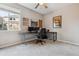 Well-lit home office space featuring gray carpet and a ceiling fan at 10358 Kelliwood Way, Highlands Ranch, CO 80126