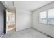 Bedroom with a window, closet and neutral colored carpet at 4865 Gibraltar St, Denver, CO 80249