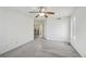 A bright bedroom showcasing a ceiling fan, natural light, and neutral paint at 4865 Gibraltar St, Denver, CO 80249