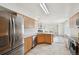 Modern kitchen with stainless steel appliances and ample counter space, creating a functional and stylish cooking area at 4865 Gibraltar St, Denver, CO 80249