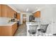 Well-lit kitchen featuring stainless steel appliances, ample counter space, and a breakfast bar, blending style with function at 4865 Gibraltar St, Denver, CO 80249