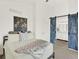 Bedroom features a rustic barn door that leads to a bathroom at 718 Fairhaven St, Castle Rock, CO 80104