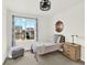 Bedroom with a large window and a decorative ceiling fan at 718 Fairhaven St, Castle Rock, CO 80104
