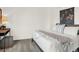Well-lit bedroom featuring neutral tones, a comfortable bed and a stylish side table at 718 Fairhaven St, Castle Rock, CO 80104