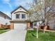 Charming two-story home with a well-maintained front yard and a two-car garage at 718 Fairhaven St, Castle Rock, CO 80104