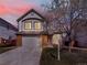 Charming two-story home with a well-maintained front yard and a two-car garage at 718 Fairhaven St, Castle Rock, CO 80104