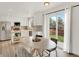 Bright kitchen with white cabinets, stainless steel appliances, and a door leading to the backyard for easy outdoor access at 718 Fairhaven St, Castle Rock, CO 80104