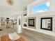 Open-concept living space with a fireplace, dining area, and modern kitchen at 718 Fairhaven St, Castle Rock, CO 80104