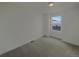 Carpeted bedroom with a neutral color scheme and a window that offers ample natural light at 12892 E 99Th Pl, Commerce City, CO 80022