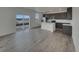 Open-concept kitchen with stainless steel appliances and large island at 12892 E 99Th Pl, Commerce City, CO 80022